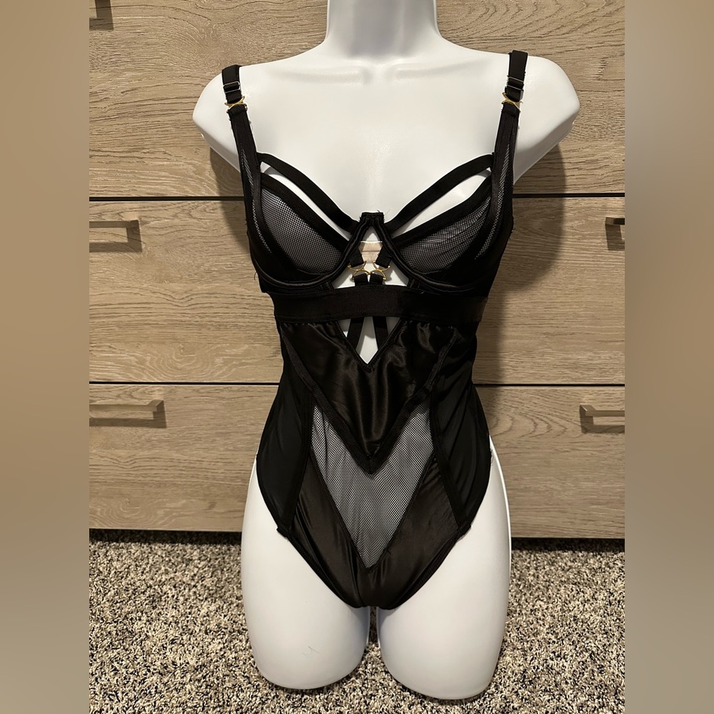 Black sheer satin cut-out bodysuit. Size small.
